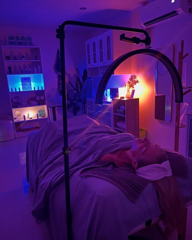 A treatment in progress in the softly lit room