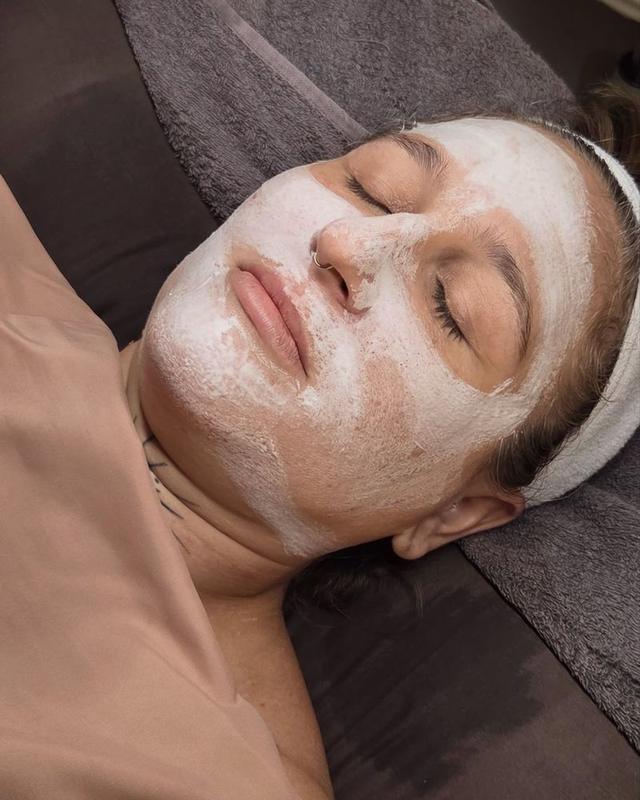 A client relaxing with a treatment mask
