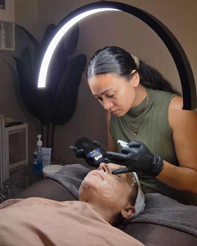 Sam mid-treatment with a facial device
